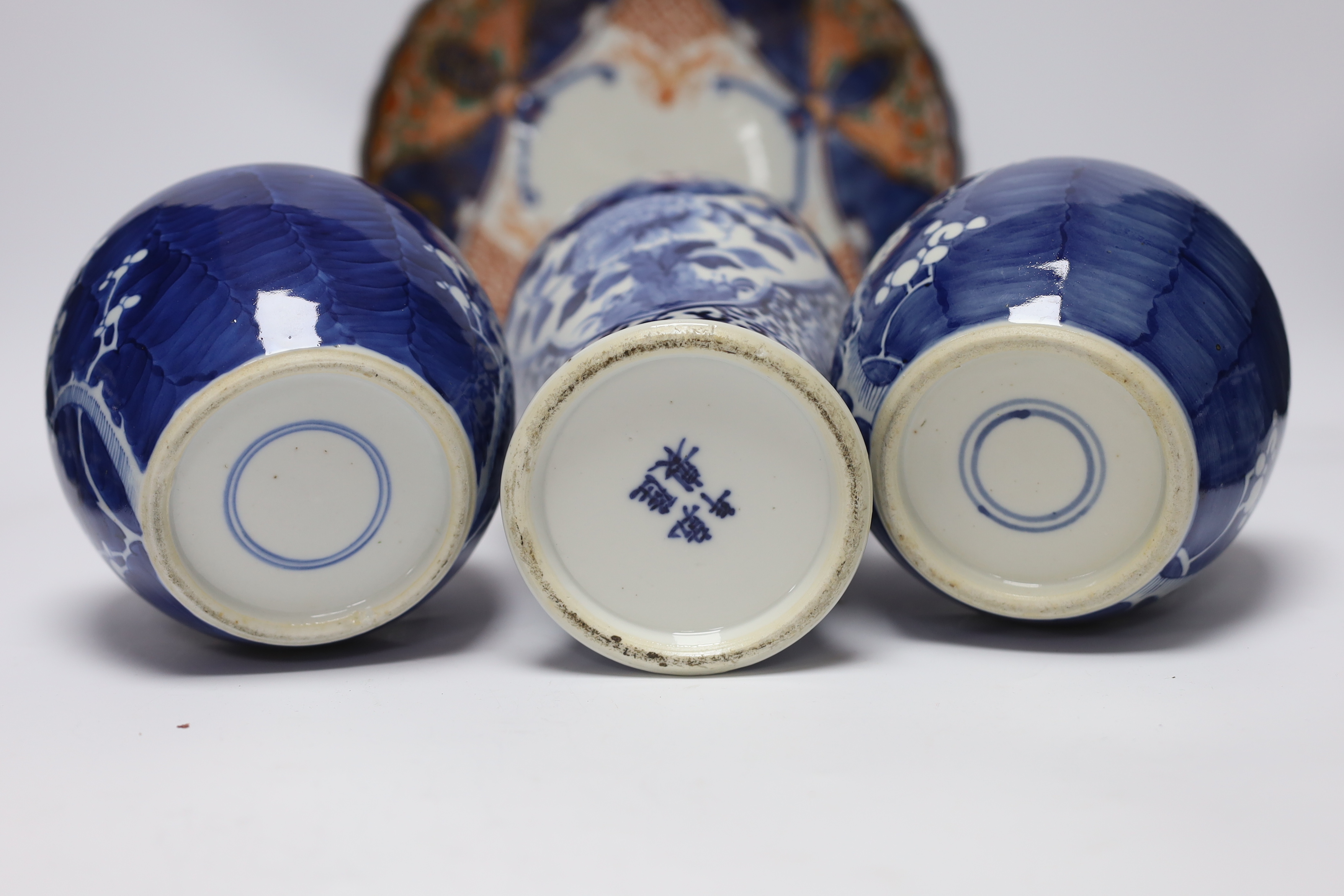 An early 20th century Chinese blue and white vase and cover, pair of 19th century Chinese famille rose dishes, four prunus jars, two covers, a Japanese Meiji period Imari dish and a small satsuma pot, some damage, talles